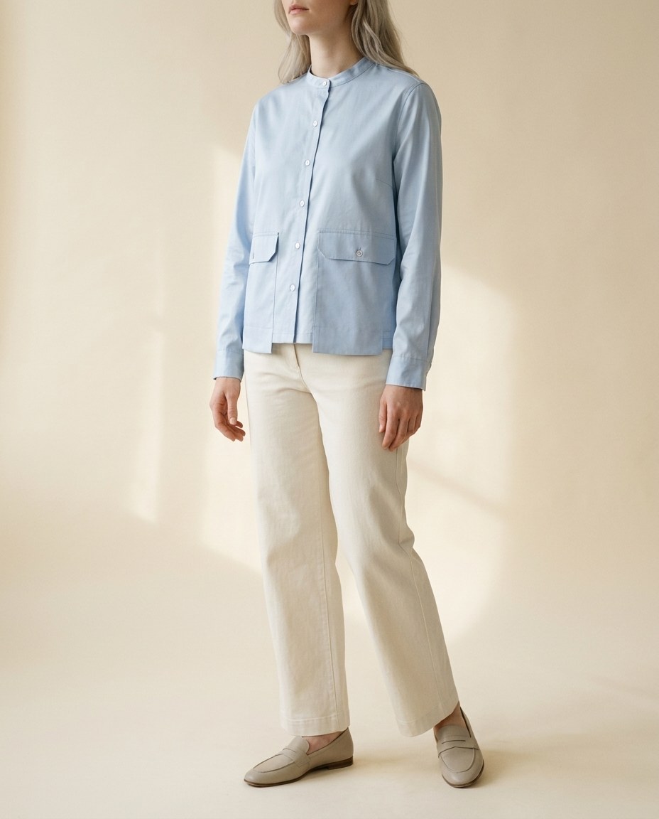 Faceless model in a powder blue poplin shirt